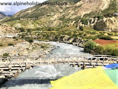 Wooden Bridge connects Manang and Gangarpurna Lake over Marshangdhi River